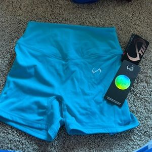 TLF tempo glo high waisted workout shorts size small in bright blue